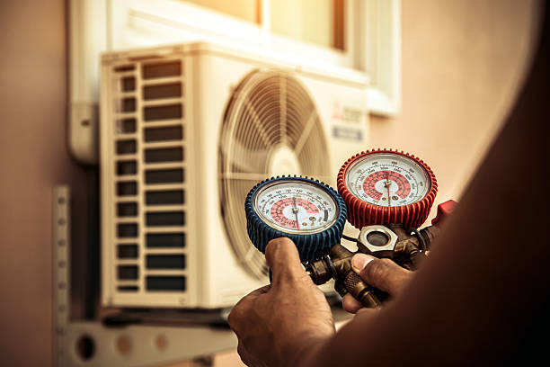 Professional Heat Pump Repair technician working in Rhodelia, KY